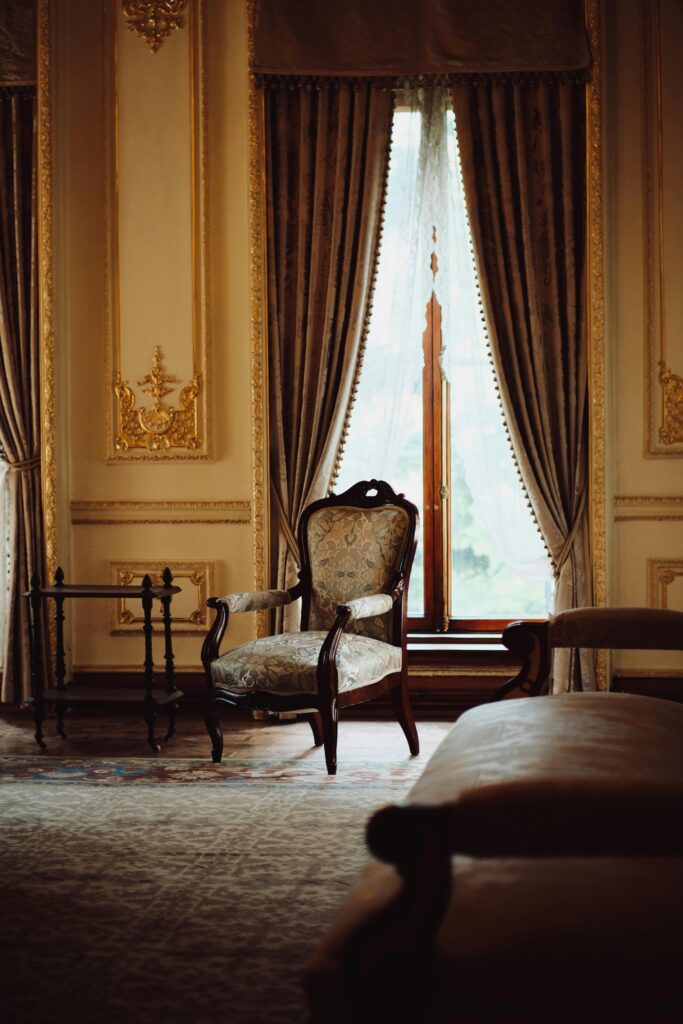 Opulent Ottoman-style room with intricate carvings and antique furniture, showcasing a historic ambiance.